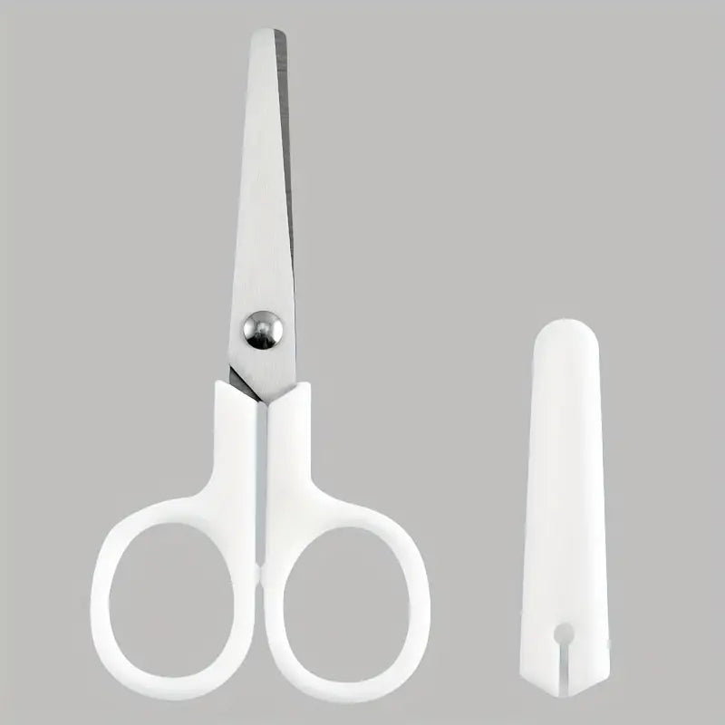 Paire de mini-ciseaux blancs à lames